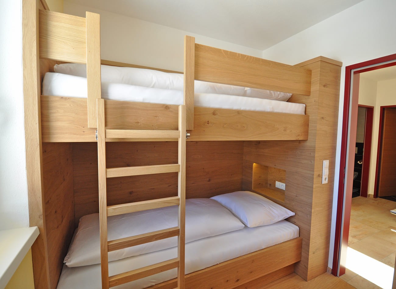 Kinderzimmer mit Etagenbett im Classic Appartement E1 der Appartements Schattauer in Wagrain